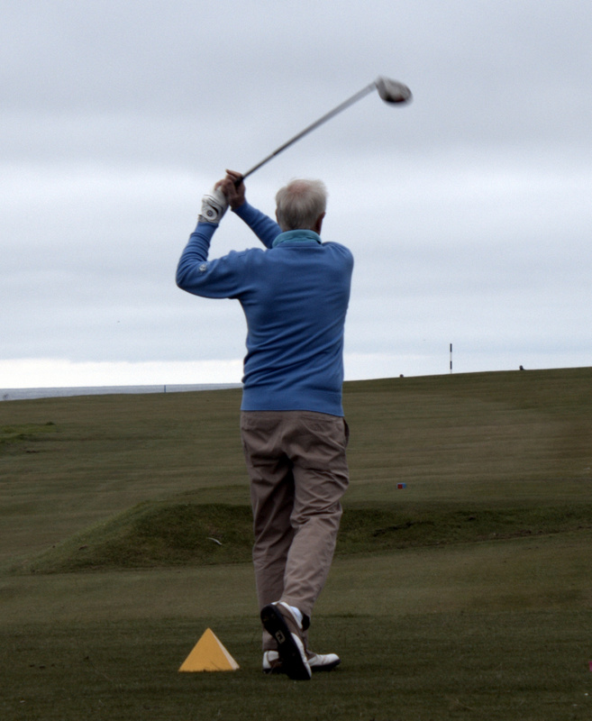 George Norrie drives at the first hole.