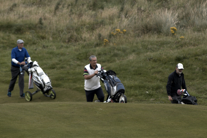 Group 1 climb up onto the 8th green.