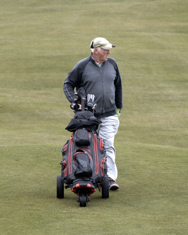 Jim Walker approaches a birdie putt on the 8th.