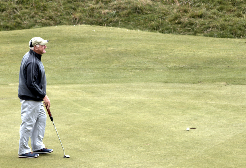 Jim's birdie putt slips away.