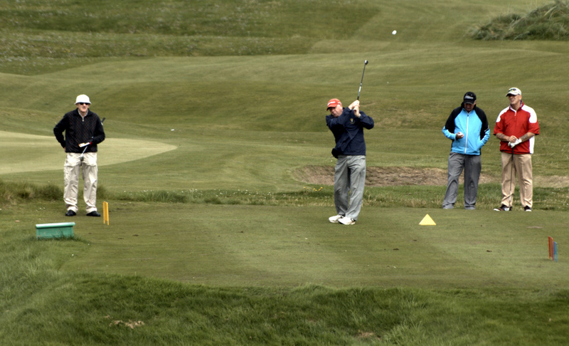 Les Mlne's tee shot at the 8th