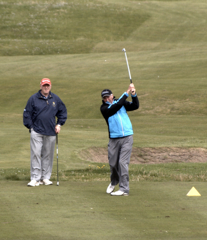 Jim Aitken plays his iron to 6 feet at the 8th.