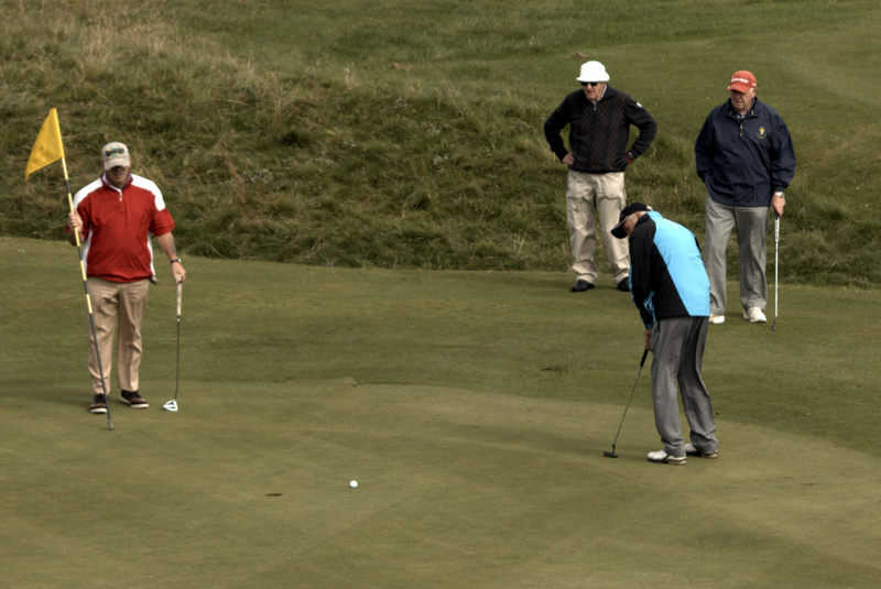..and sinks his birdie putt!